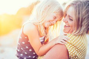 smiling child and mom