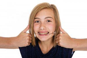 child with orthodontic headgear 