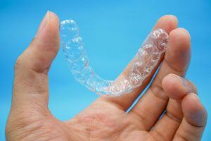 man holding Invisalign in Powell