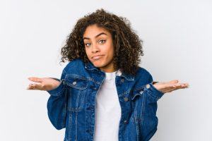 young woman shrugging