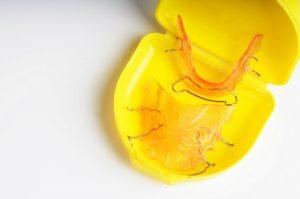 removable retainers in yellow case